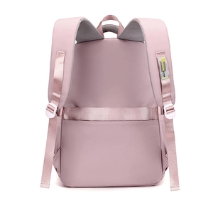 Detail of pink travel backpack featuring breathable mesh straps and luggage fixing belt