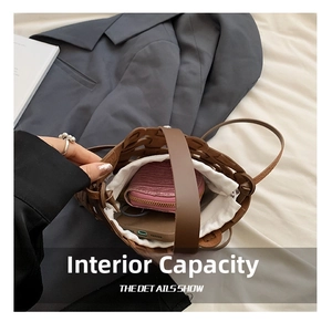 Internal view of brown hollow woven bag showing space for wallet and phone