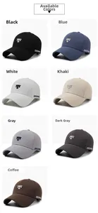 Detail view of embroidered cotton baseball caps in seven versatile color options