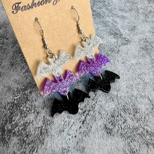 Halloween glitter bat earrings with silver purple and black dangling triple tiers