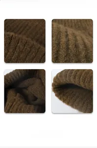 Close-up of thick ribbed knit texture and soft dark brown wool fabric detail