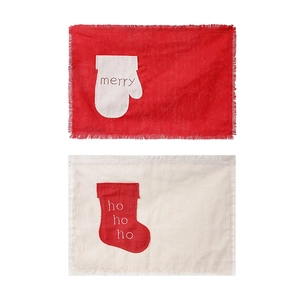 Christmas burlap placemats with festive red mittens and stockings for table decor