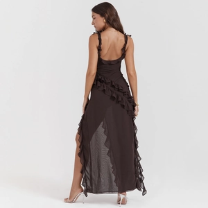 Detail of ruffle shoulder straps and open back design on elegant deep brown maxi dress