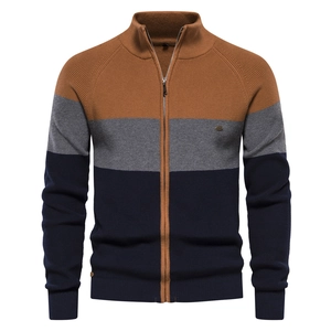 Close-up of tricolor patchwork knitted cardigan with high-quality zipper and stand collar
