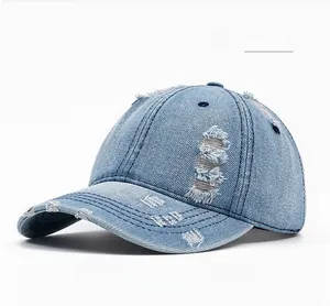 Detail of distressed light blue denim fabric and frayed edges on this vintage baseball cap