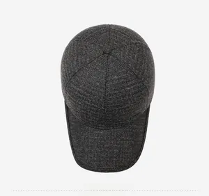 Top view of thick wool blend baseball cap with ear flaps in textured dark grey