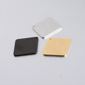 Detailed view of silver, black and gold square stainless steel DIY jewelry pendants