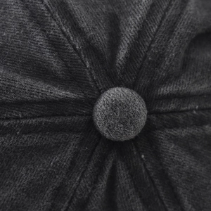 Macro shot of the black washed cotton cap crown showing premium twill texture and button