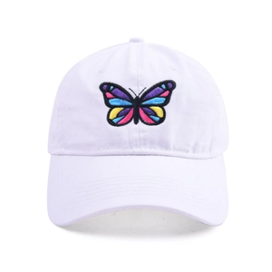 Detailed close-up of rainbow butterfly embroidery on a white cotton baseball cap