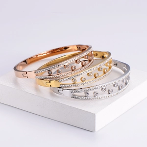 Three-piece stackable 18k gold plated titanium bangles with zircon inlay in gold rose and silver