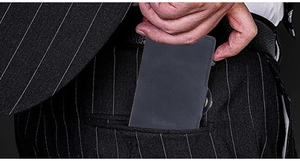 Detail showing the automatic RFID card holder being tucked into a navy pinstripe suit pocket