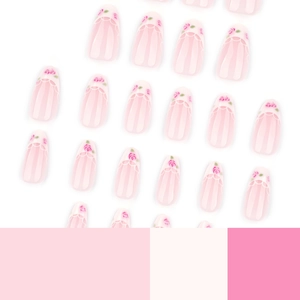 Pink rose French almond press-on nails with white lace design on white background
