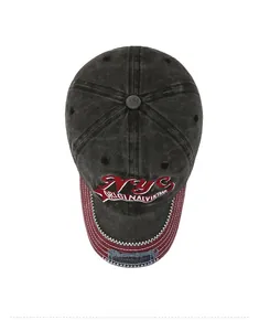 Detail of vintage washed baseball cap with NYC embroidery and distressed red brim