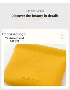 Detail of yellow PU leather mini pouch showing neat stitching and embossed brand logo