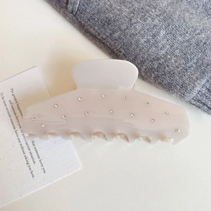Pale pink hair claw clip with sparkling rhinestones for thick hair styling