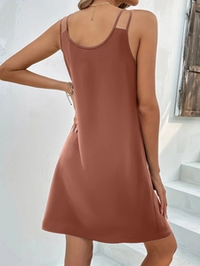 Back view of a sleek reddish brown V-neck sleeveless dress with cross strap details