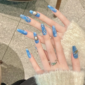 Denim style handmade press-on nails with blue fabric texture and pearl accents