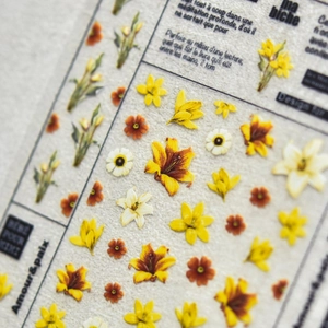 Japanese style yellow lily nail art stickers with 3D embossed floral patterns and French text