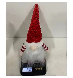 Macro view of Christmas gnome weighing 80g with red sequin hat and white long beard
