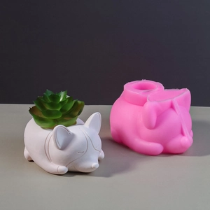 Macro view of a pink silicone mold and finished Corgi puppy flower pot for succulents