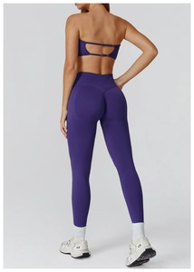 Detail view of seamless dark purple leggings with ruched butt lift and high waist