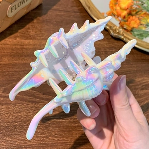 Detailed view of large shell hair claw clip with colorful iridescent pearl finish coating