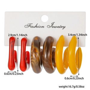 Detailed view of resin C-shape hoop earrings with measurements in red, marble, and yellow
