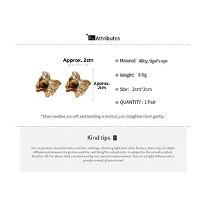 Detailed view of vintage gold tiger eye stone geometric earrings with size specifications