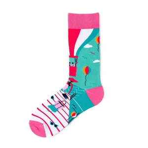 Detailed view of mid-calf socks with vibrant hot air balloon and beach vacation illustration