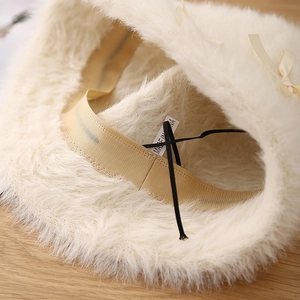 Plush faux fur bucket hat for women in cream white with a sweet decorative ribbon bow