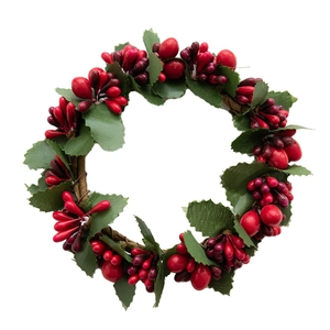 Artificial Christmas wreath with red berries and green leaves on a white background