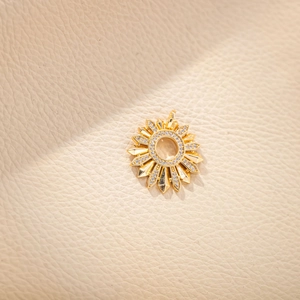 Golden sunflower pendant necklace with inlaid diamonds on a beige leather background