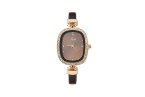 Detail view of oval crystal-bezel watch with brown gradient dial and leather strap