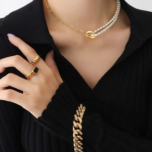 Minimalist freshwater pearl necklace with gold paperclip chain on a model