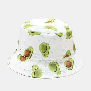 White bucket hat featuring vibrant cartoon avocado patterns with wide sun-protective brim