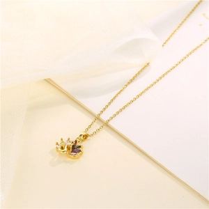 Elegant gold peacock fan pendant necklace with colorful cubic zirconia on white background