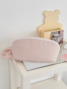 Pink minimalist large capacity handheld makeup bag with handle and zipper closure