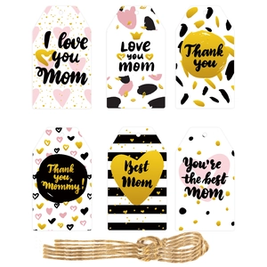 Macro shot of assorted Mother's Day gift tags featuring floral designs and natural jute twine