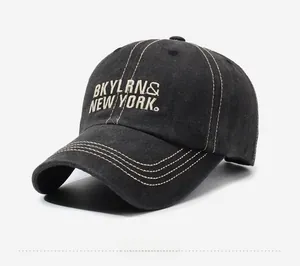 Detail of vintage washed cotton baseball cap featuring BKYLRN embroidery and contrast stitching