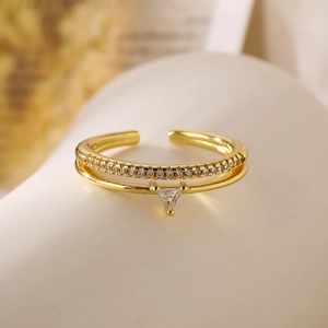 Detail of 18K gold plated double-layer ring featuring a triangle zircon and pavé crystals