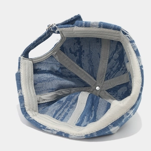 Detailed interior of blue washed denim brimless docker hat with reinforced grey lining