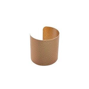 Irregular hammered metal open bangle with textured gold finish in a minimalist C-shape
