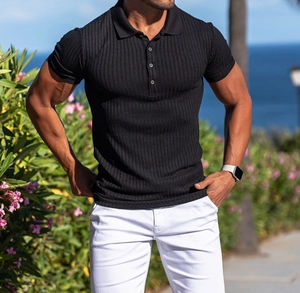 Close-up of black slim fit polo shirt with vertical ribbed knit texture on male model