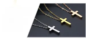 Detailed view of titanium steel cross necklaces in silver, gold, and rose gold finishes