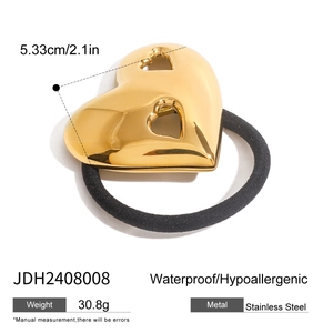 Detail of a golden stainless steel heart hair tie showing its dimensions and waterproof features