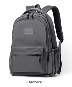 Close-up of durable dark grey fabric and breathable honeycomb mesh straps on the backpack