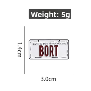 Macro shot of BORT license plate enamel pin showing precise dimensions 3.0cm by 1.4cm
