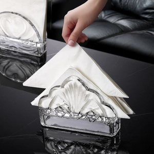 Modern fan-shaped crystal glass napkin holder with elegant embossed texture for dining decor
