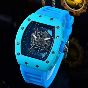 Macro shot of sky blue tonneau-shaped skeleton watch with visible inner gear mechanism
