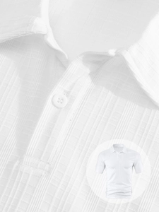 Close-up of white men's polo shirt featuring textured waffle knit fabric and ribbed collar